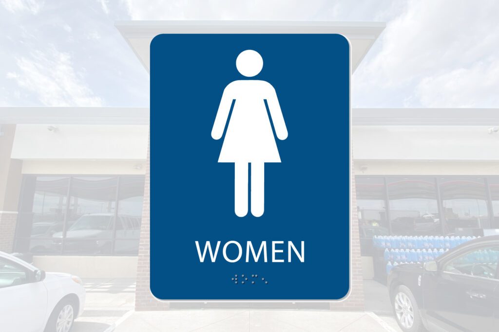 Women's restroom sign with braille.