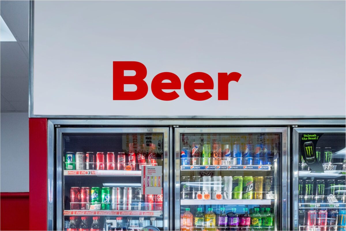 Refrigerated display with beer, soda, and energy drinks.