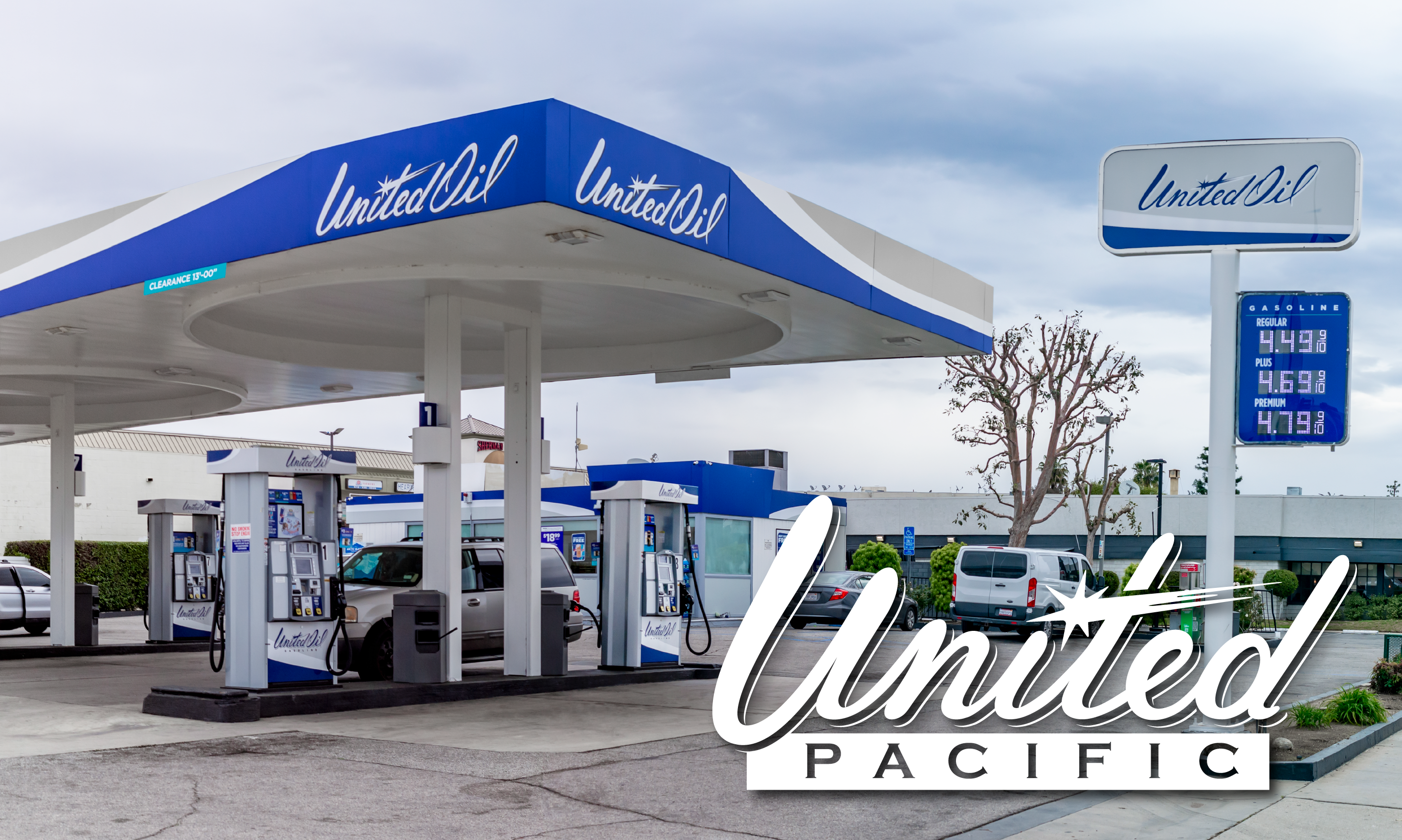 United Oil gas station with pumps and cars.