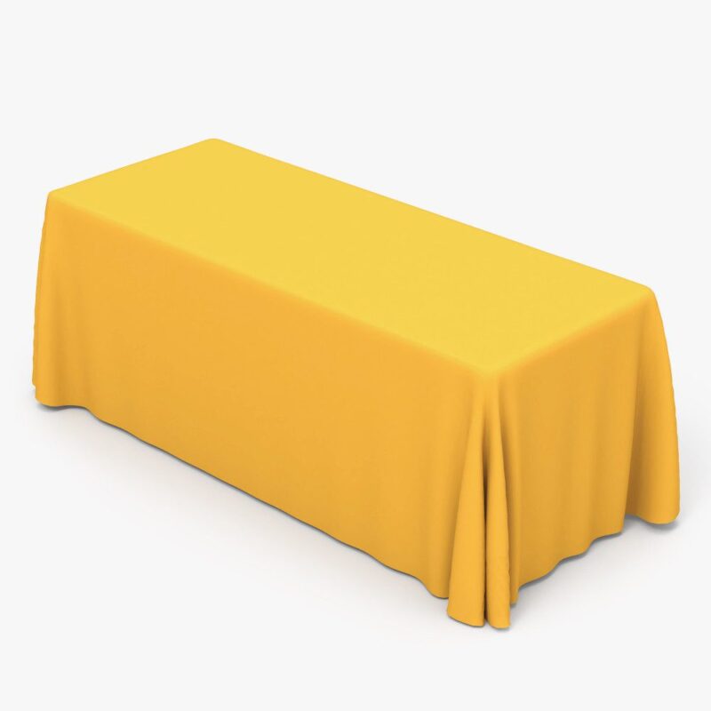 Yellow rectangular tablecloth on table.