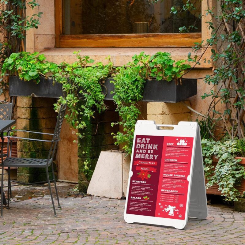 Christmas menu A-frame sign outdoors.